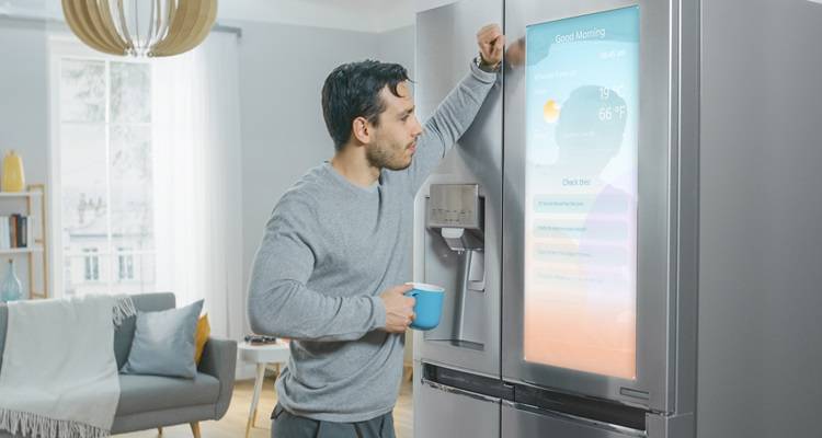 Man looking at smart fridge