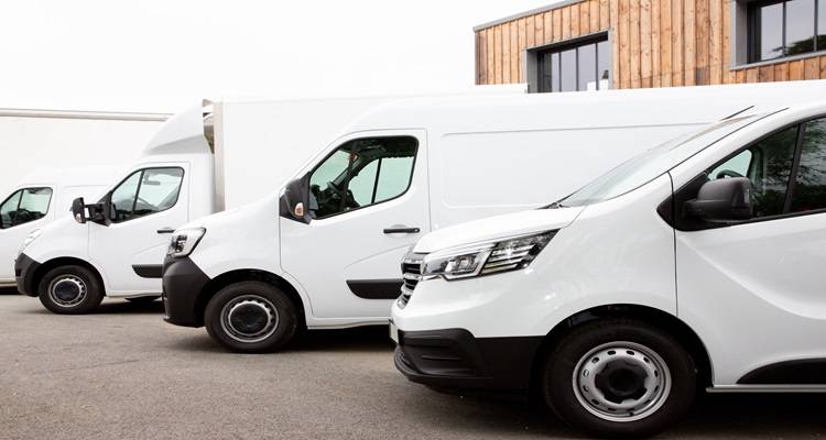 row of four vans