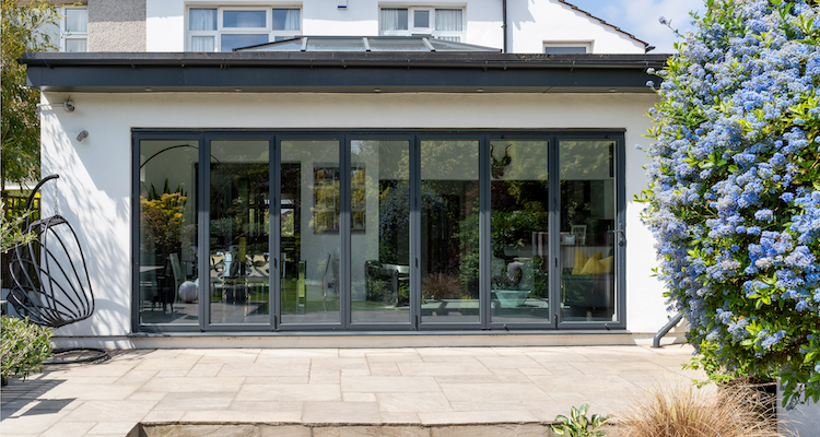 closed grey bifold door installation leading into an open plan property in the UK