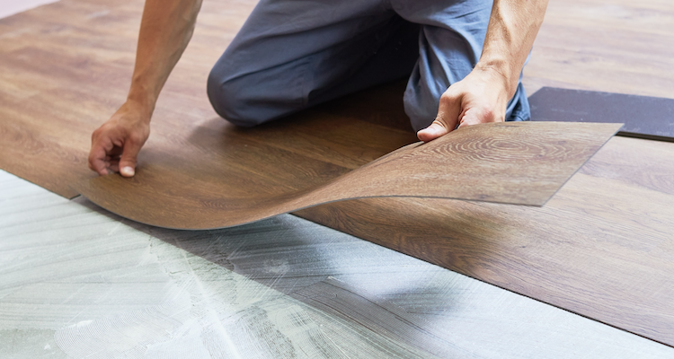 vinyl flooring being installed in a bathroom