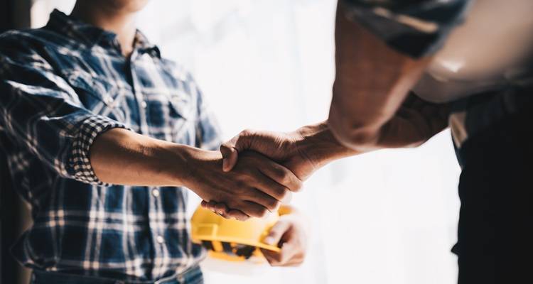 workman shaking hands