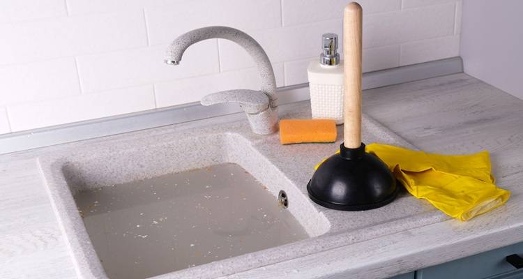 blocked sink full of water