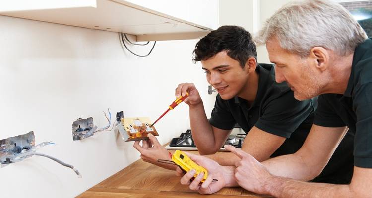 two men wiring sockets