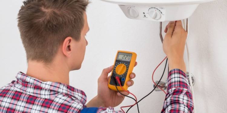 person checking electric boiler