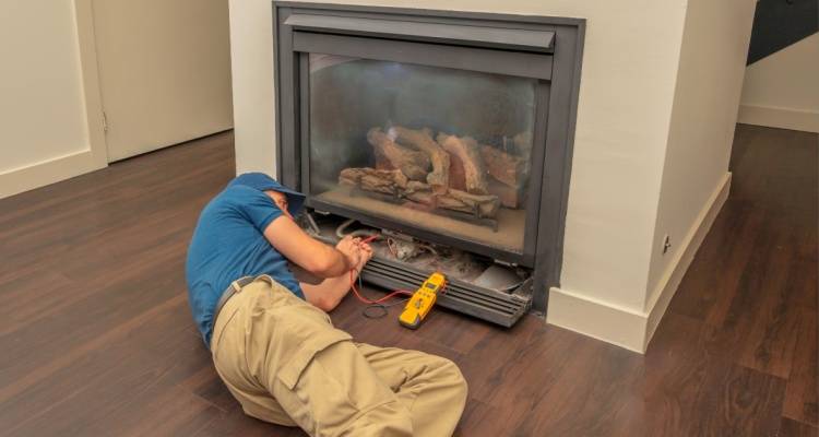 person repairing electric firepalce