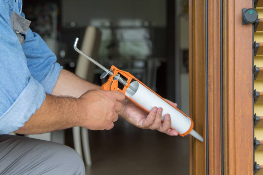 person sealing door