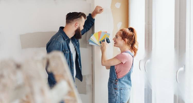 Couple looking at paint charts