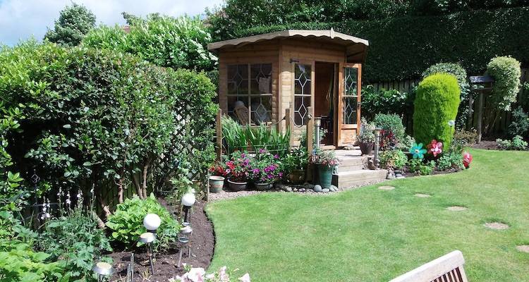 house extension cost guide — summer house in a UK garden