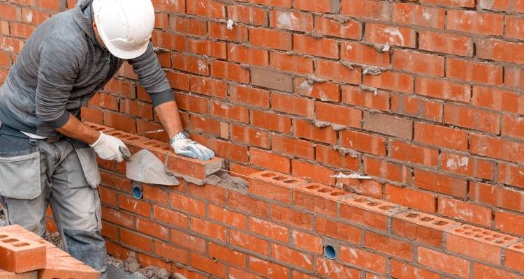 person bricklaying