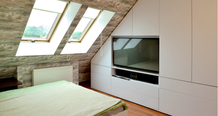 custom fitted wardrobe with a TV space in a loft conversion