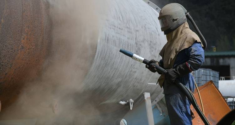 man sandblasting