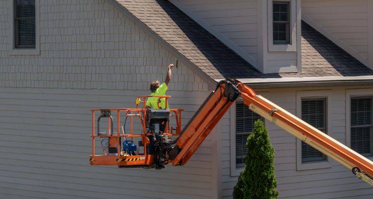 house exterior painting with cherry picker