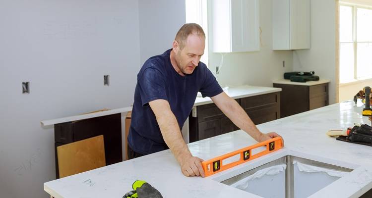 Man levelling worktop