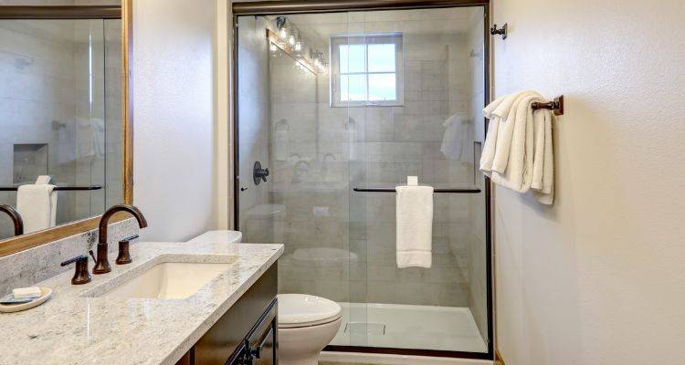 shower with grey ceramic tiles