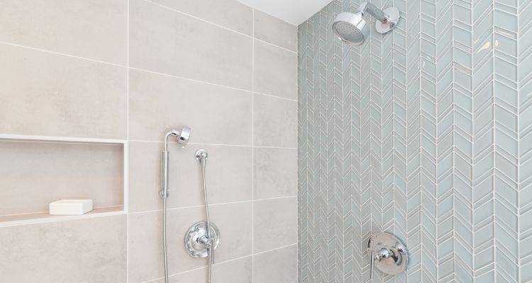 shower with light blue glass tiles