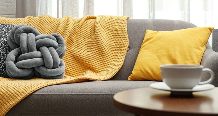 sofa and yellow blanket