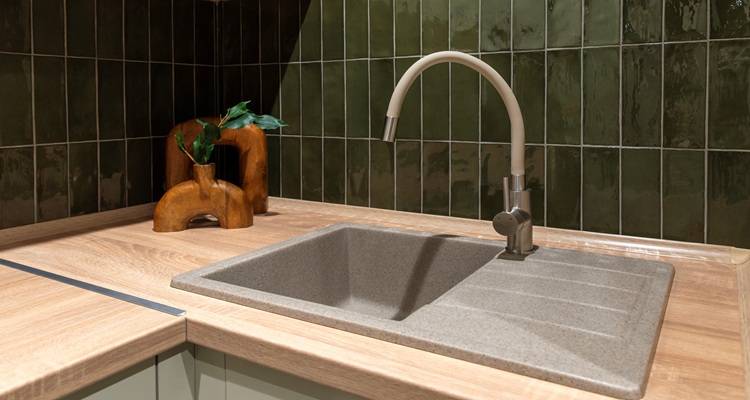 green kitchen tiles and sink