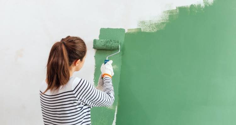 woman painting wall